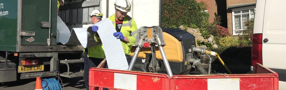 uv resign impregnated liner being inserted into manhole cover
